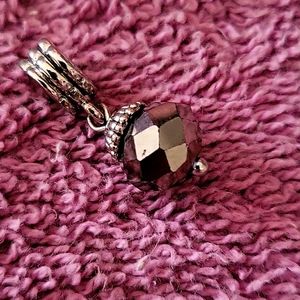 Swarovski crystal briolette charm in gray and set on a sterling silver bail